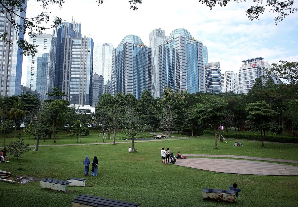Jakarta business-district skyline seen from Hutan Kota GBK, 2024.